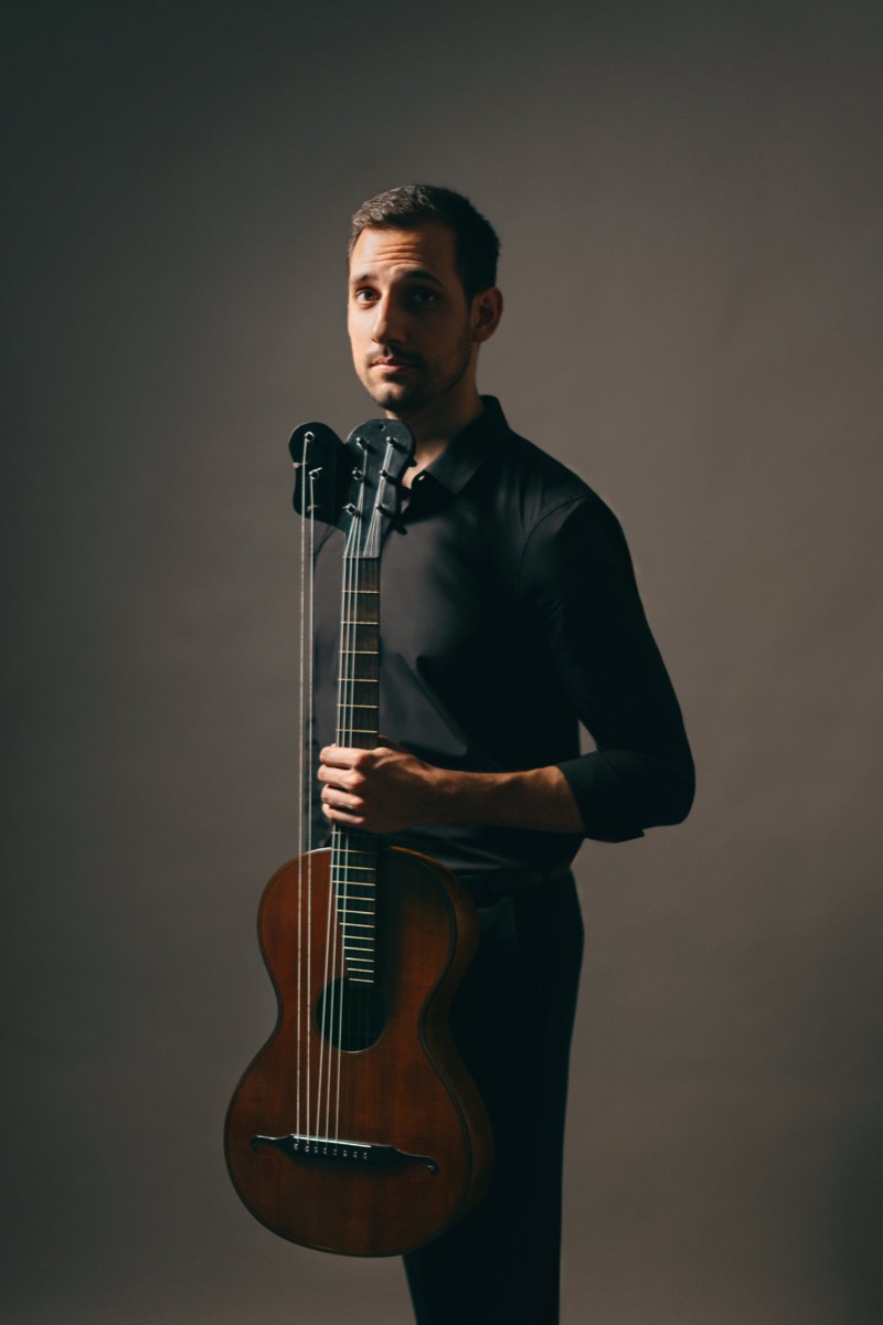 André Ferreira holding a classical guitar